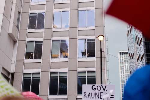 Employees in Loop offices looked on from above as the rally grew in size, Luke White