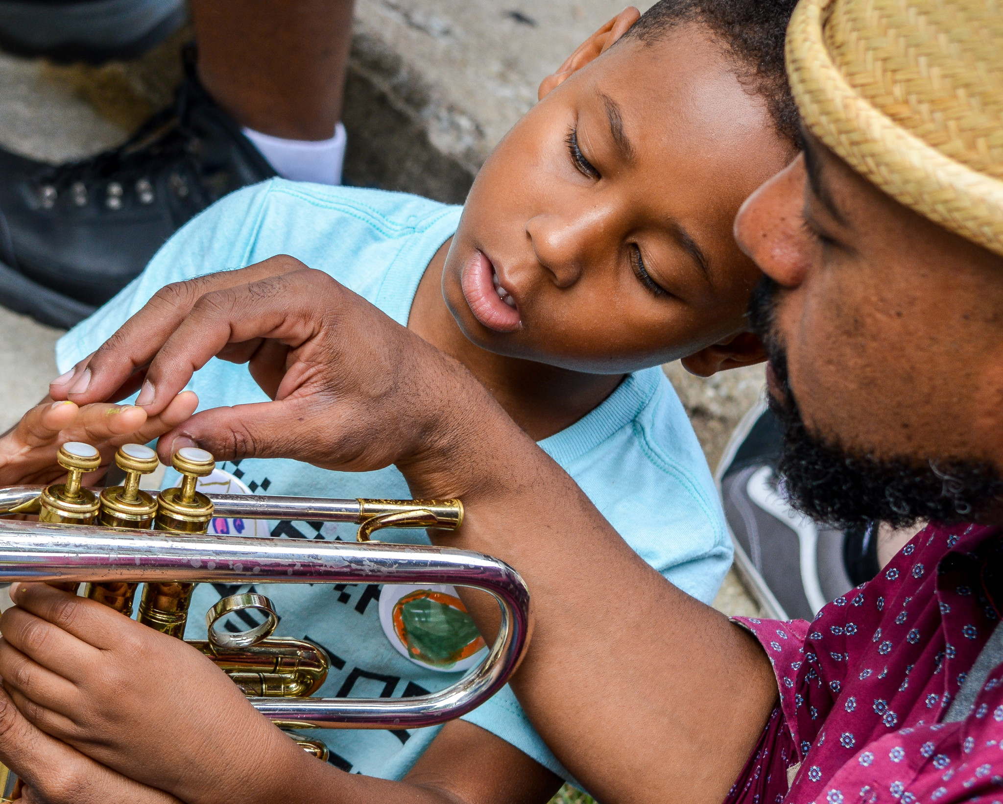 Ben Lamar Gay shows a young attendee his trumpet (Bridget Vaughn)