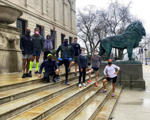 Black and brown runners posing outside the Art Institute in downtown Chicago