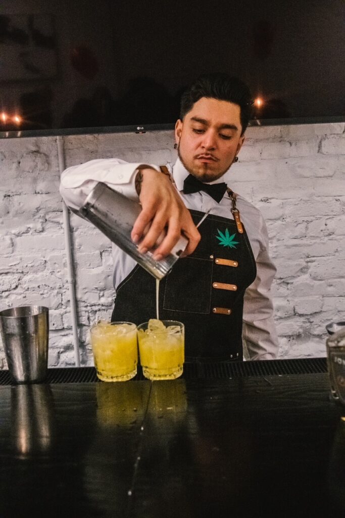 Carlos Ramos mixing infused THC cocktails. Photo Credit: David Austin.