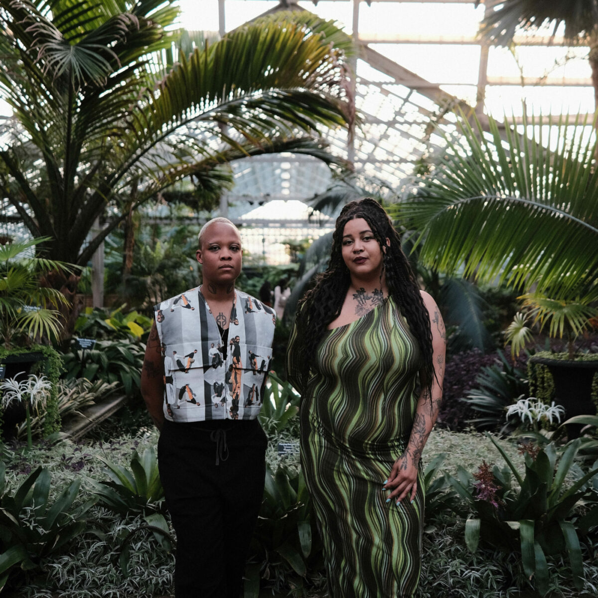 Kee Merriweather (left) and Onyx Engobor (right) stand in the Garfield Park Conservatory Palm House during the “Otherworldly” gallery opening. Photo by Sulyiman Stokes