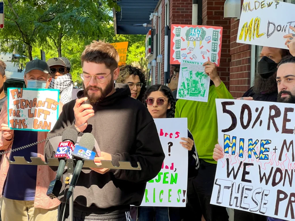 Alex Wirt at a news conference in May 2024. Wirt spoke about his experiences living in a building with code violations and why he and his neighbors formed a tenant union.
